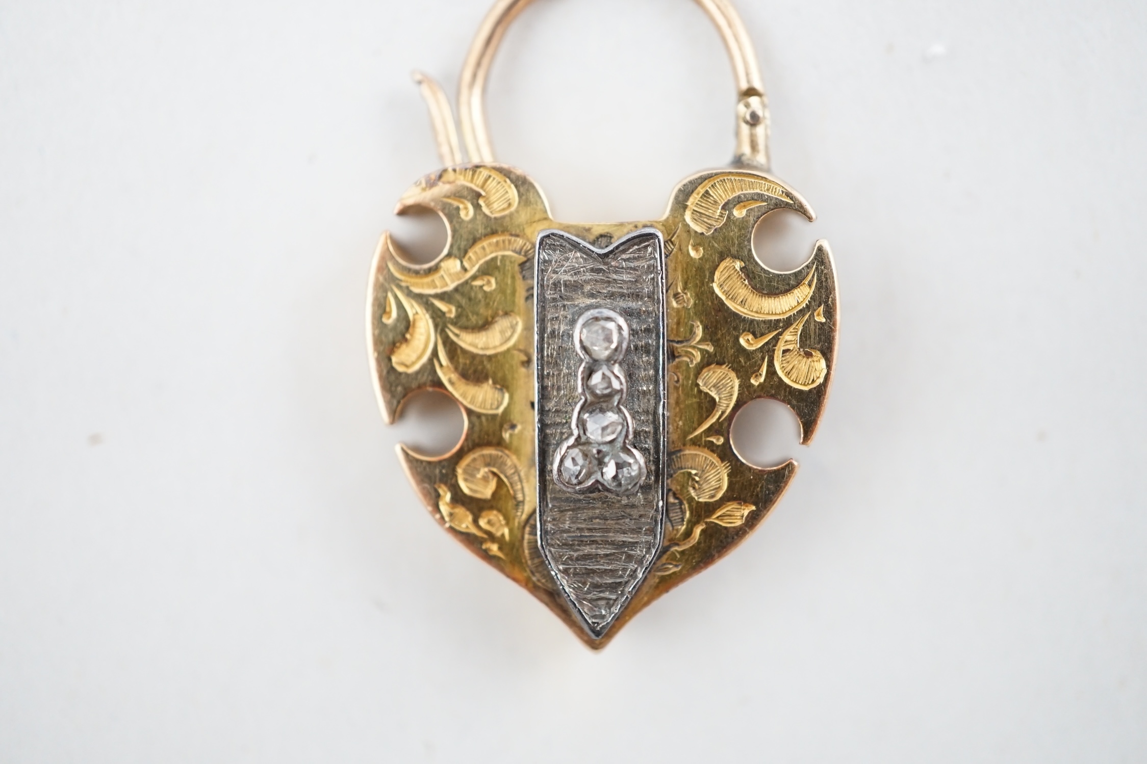 A Victorian engraved gold, carnelian and five stone rose cut diamond set padlock pendant